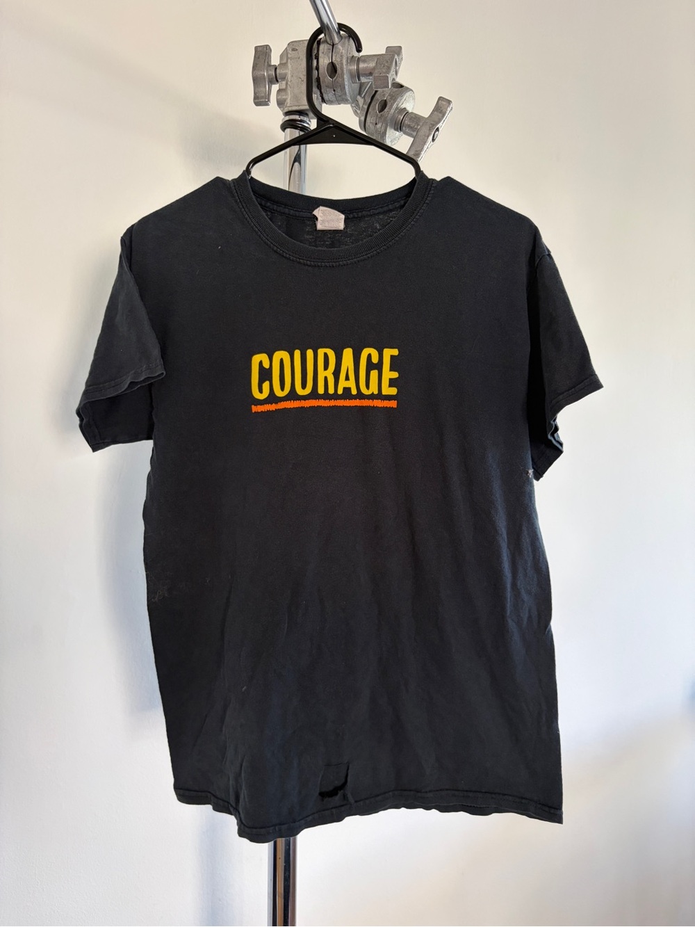 Black 'COURAGE' Graphic Tee with Yellow & Orange Text